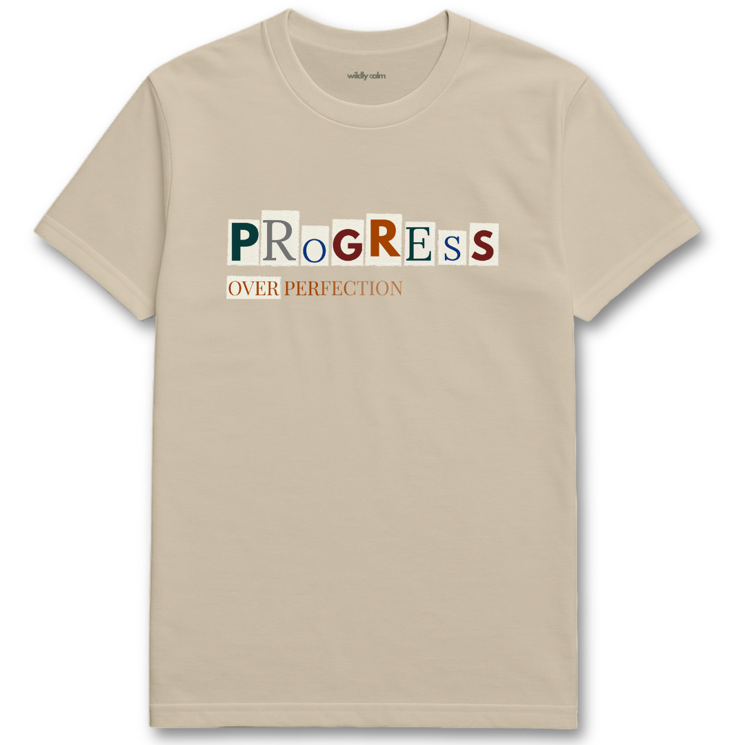 Beige/ sand yoga t-shirt with 'PROGRESS OVER PERFECTION' text design - wildly calm