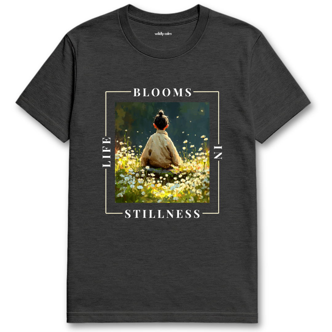 Life Blooms In Stillness heather dark grey yoga t-shirt with a graphic of a person sitting in a field and text 'BLOOMS LIFE STILLNESS' - wildly calm