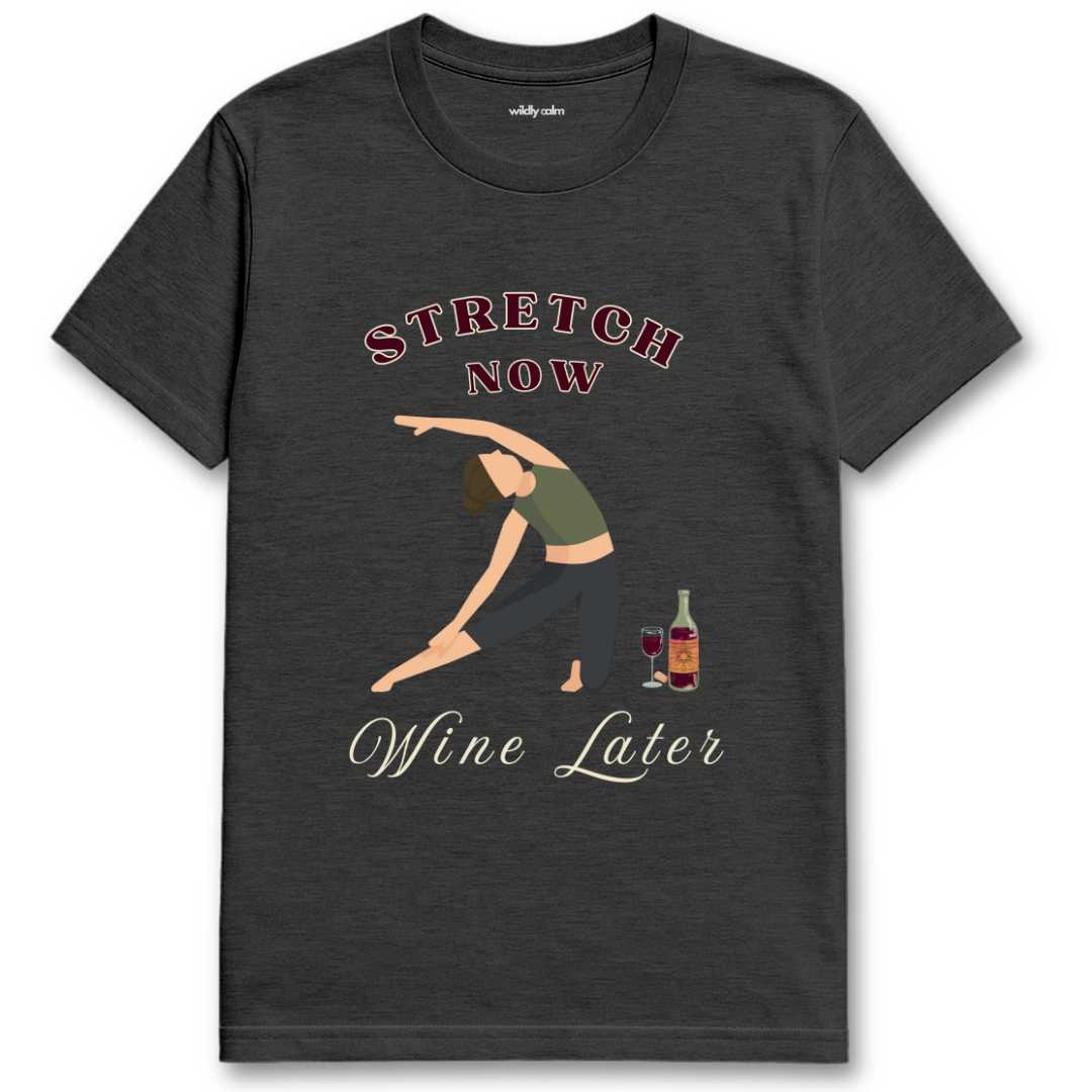 Wildly Calm Heather Dark Grey yoga t-shirt with a graphic of a person stretching and text 'Stretch Now Wine Later' on a white background.