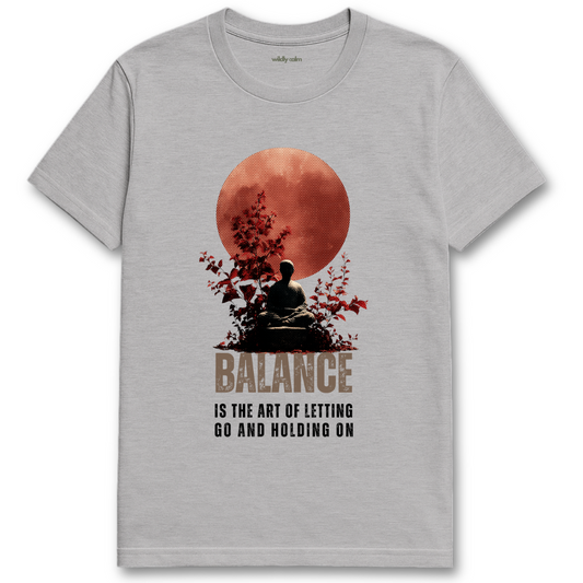Life Balance Quote_Sports Grey yoga t-shirt with a graphic of a person meditating under a red moon and the text 'Balance is the art of letting go and holding on'. - wildly calm