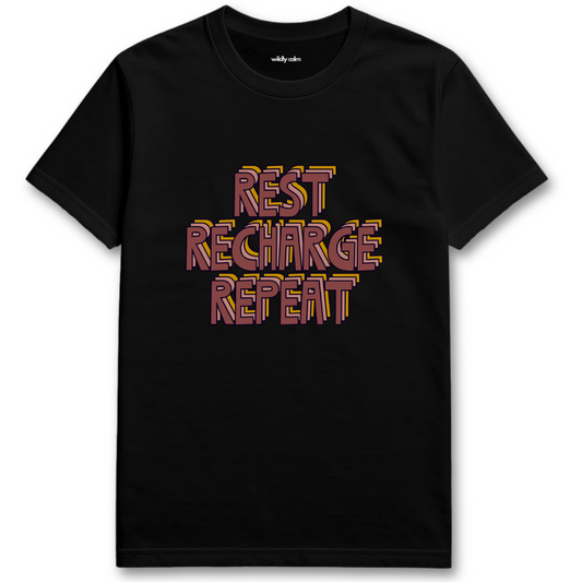 Black yoga t-shirt with 'REST RECHARGE REPEAT' text in colorful letters - wildly calm