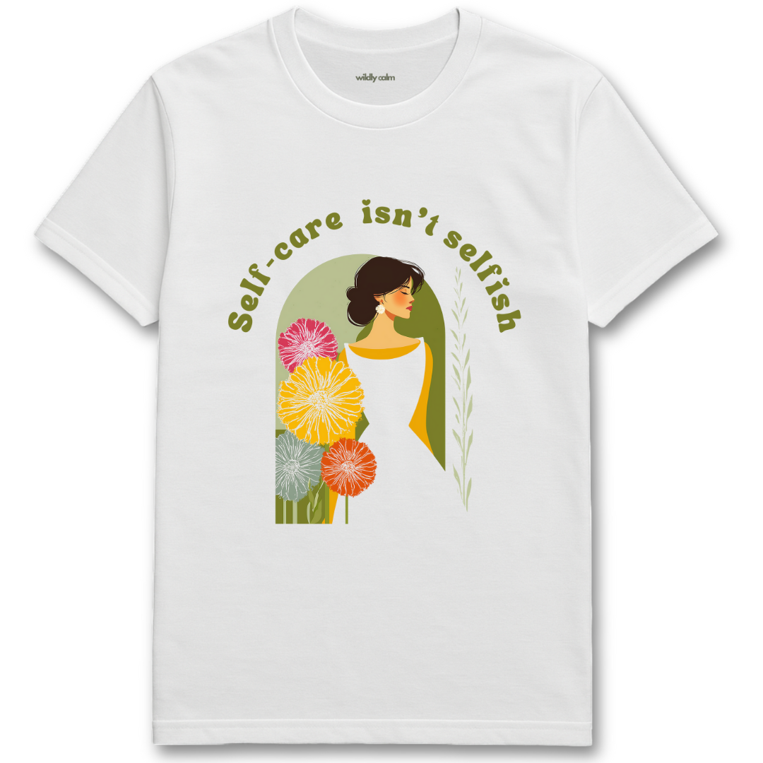 Self Care Isn't Selfish white yoga t-shirt with a graphic of a woman surrounded by flowers and the text 'Self-care isn't selfish'. - wildly calm