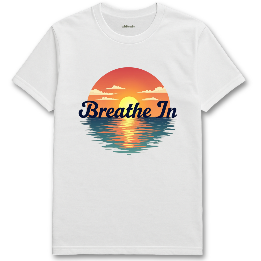 Sunrise-BreathIn_White yoga t-shirt with a sunset graphic and 'Breathe In' text - wildly calm