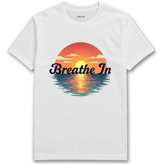Sunrise-BreathIn_White yoga t-shirt with a sunset graphic and 'Breathe In' text - wildly calm